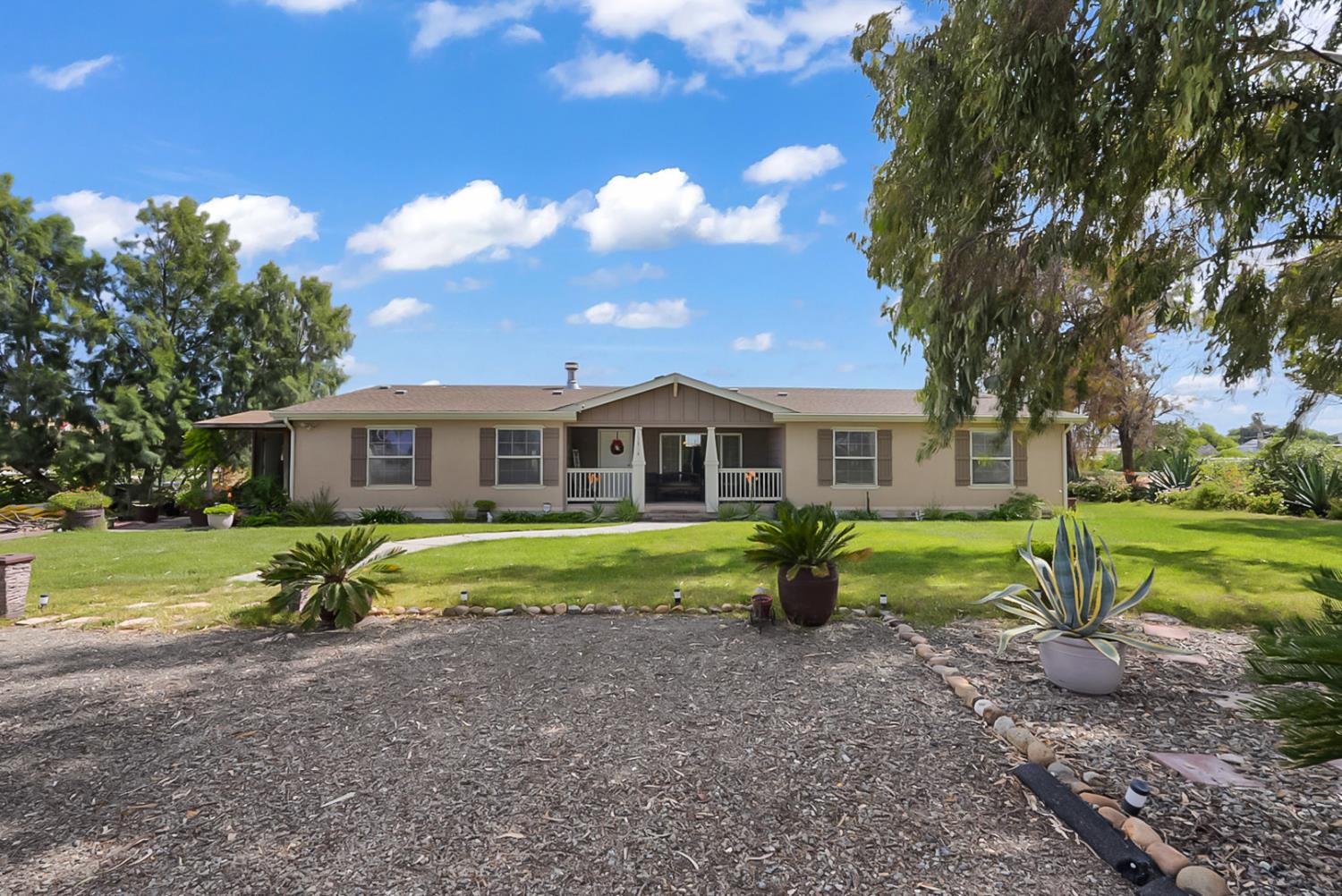 19814 West Grant Line Road Tracy, CA 95391 - Photo 26 of 57 a front view of house with outdoor space and yard