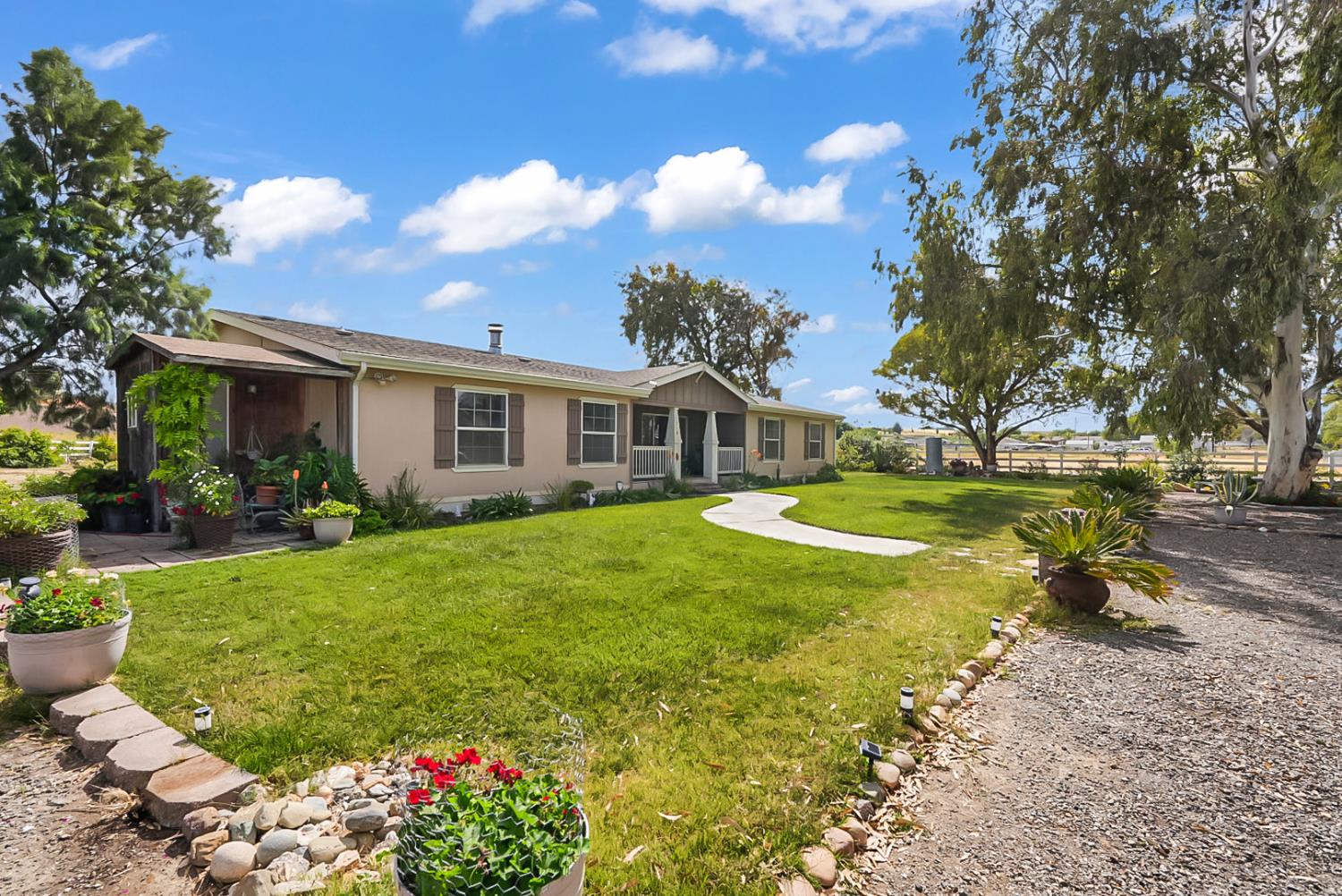 19814 West Grant Line Road Tracy, CA 95391 - Photo 27 of 57 a view of a house with swimming pool and garden