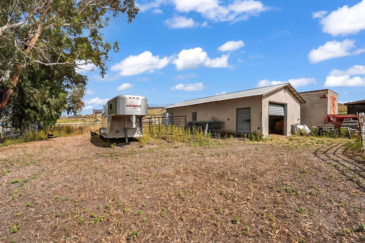 19814 West Grant Line Road Tracy, CA 95391 - Photo 33 of 57 a view of a house with a yard