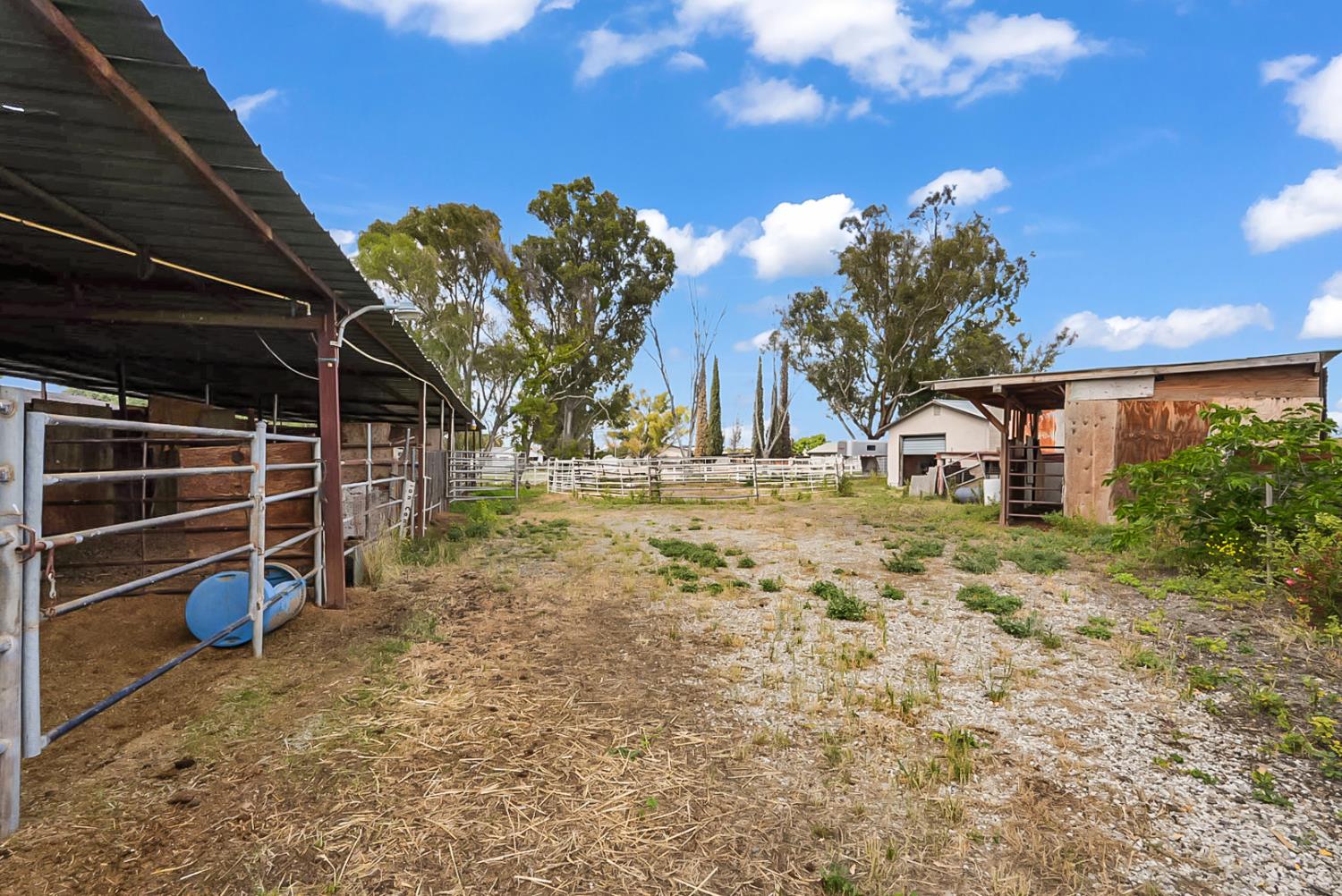 19814 West Grant Line Road Tracy, CA 95391 - Photo 36 of 57 a view of a backyard with wooden fence