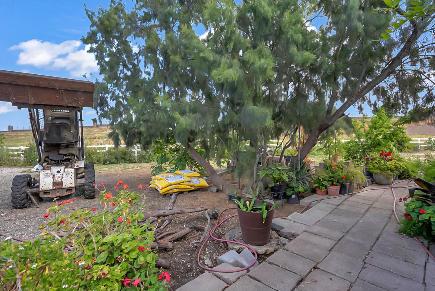 19814 West Grant Line Road Tracy, CA 95391 - Photo 42 of 57 a view of a garden with sitting area
