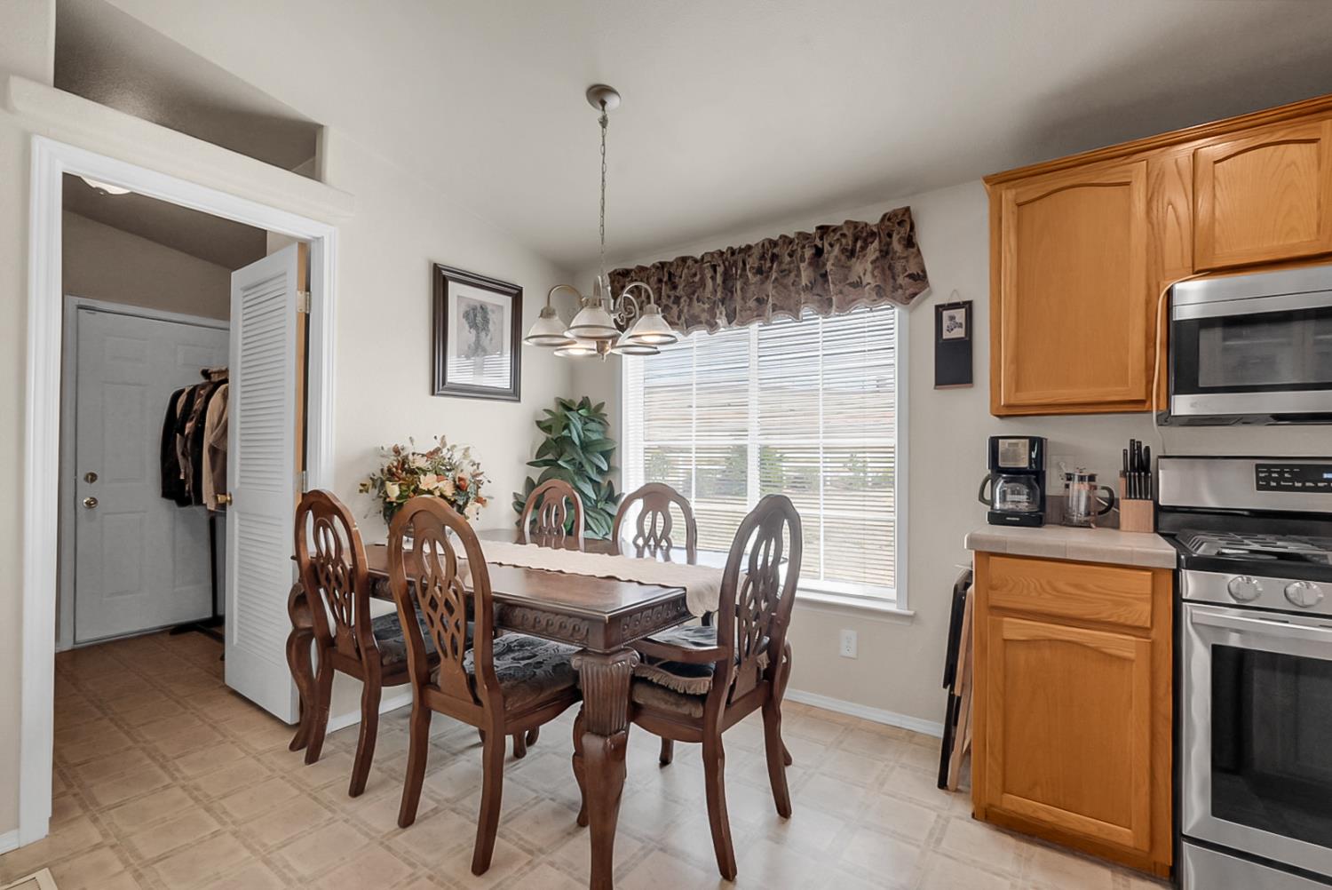 19814 West Grant Line Road Tracy, CA 95391 - Photo 9 of 57 a dining room with furniture and window
