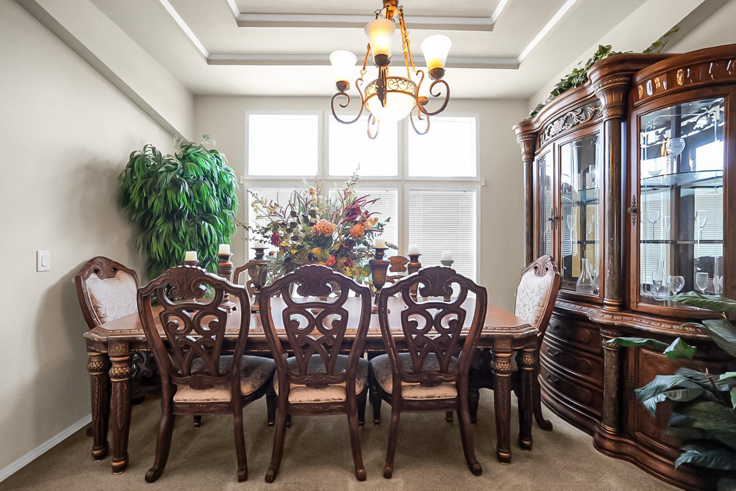 19814 West Grant Line Road Tracy, CA 95391 - Photo 10 of 57 a view of a dining room with furniture and a chandelier