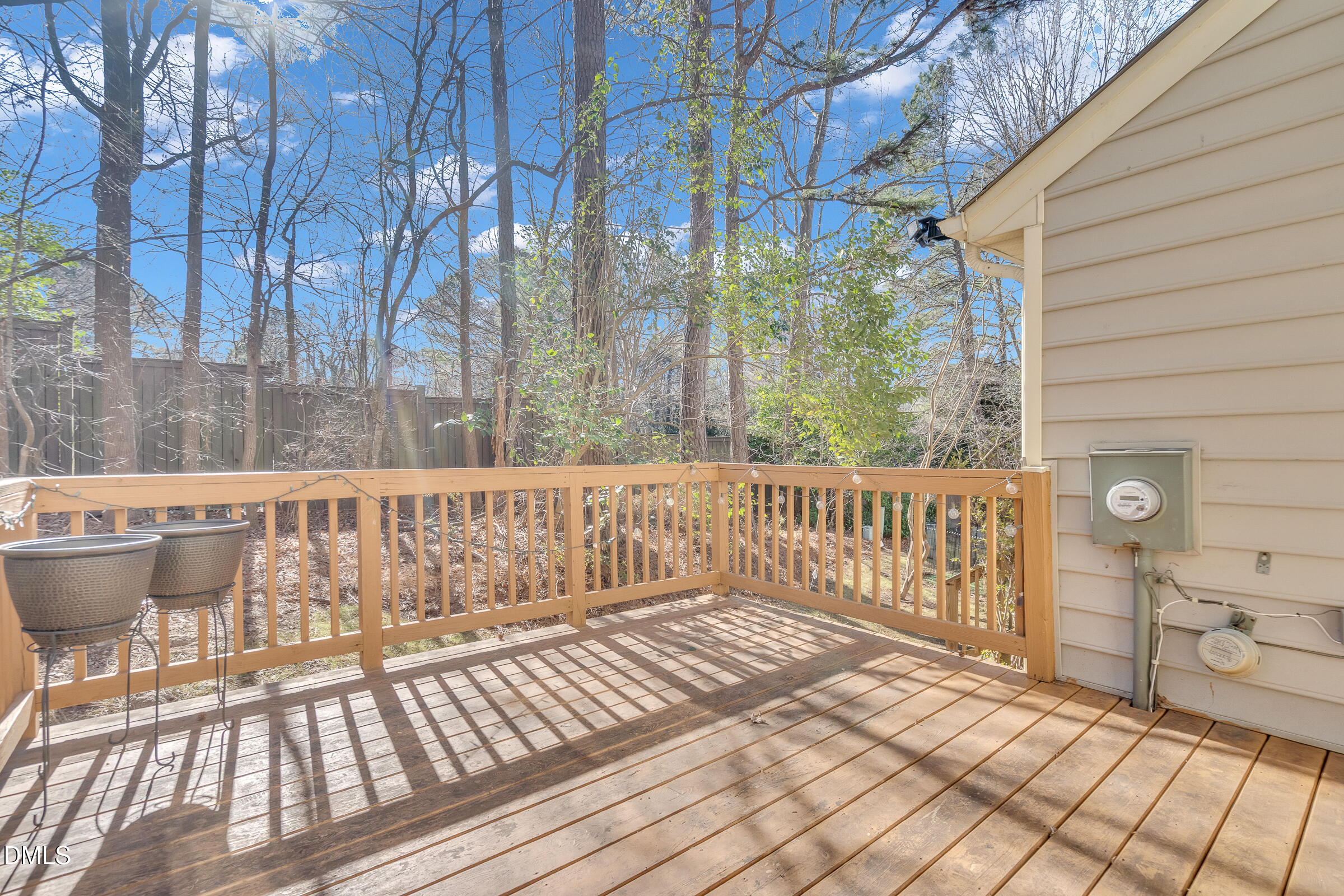 6410 English Oaks Drive Raleigh, NC 27615 - Photo 16 of 19 a view of a balcony with wooden fence