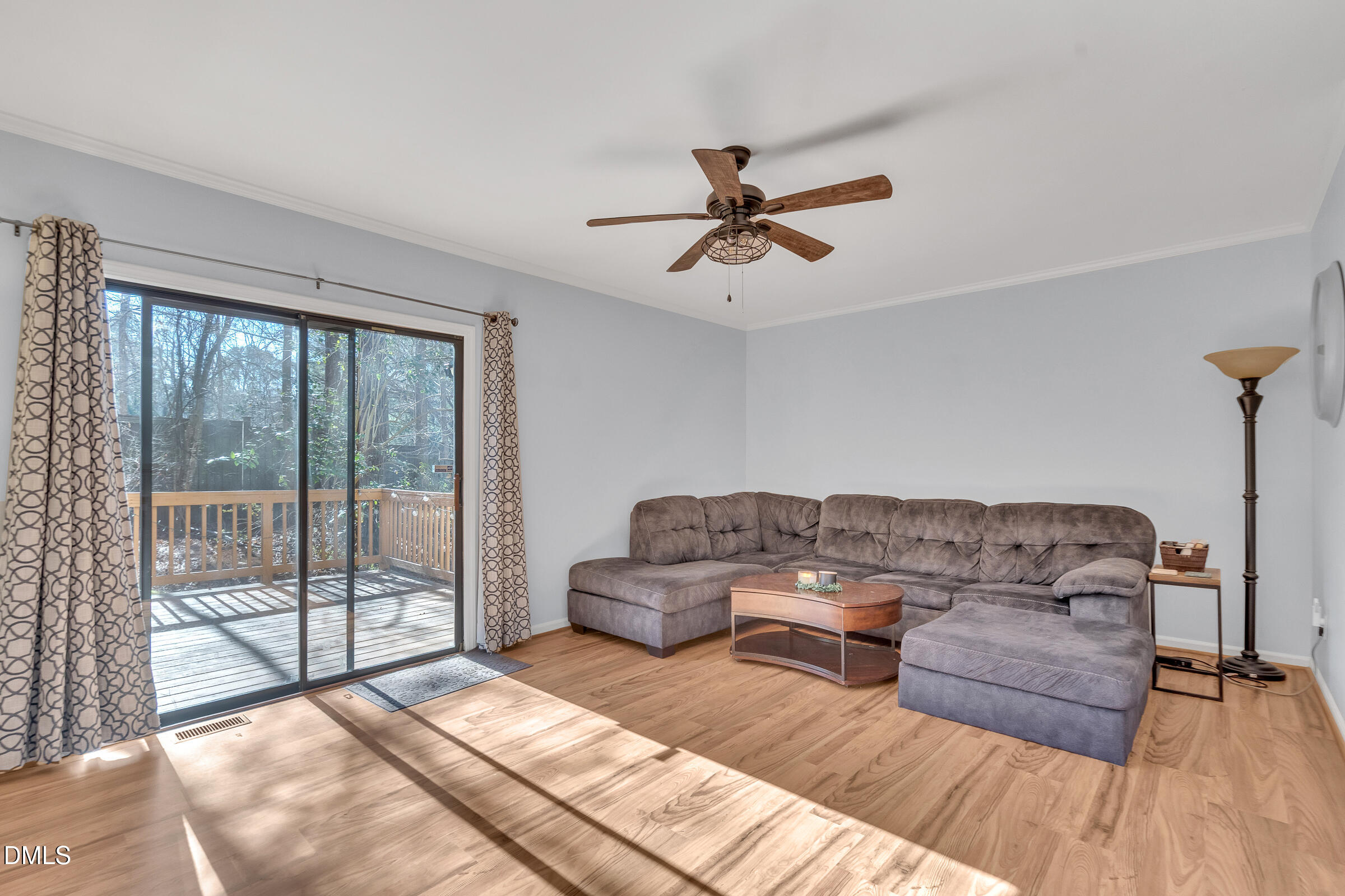 6410 English Oaks Drive Raleigh, NC 27615 - Photo 4 of 19 a living room with furniture and a large window