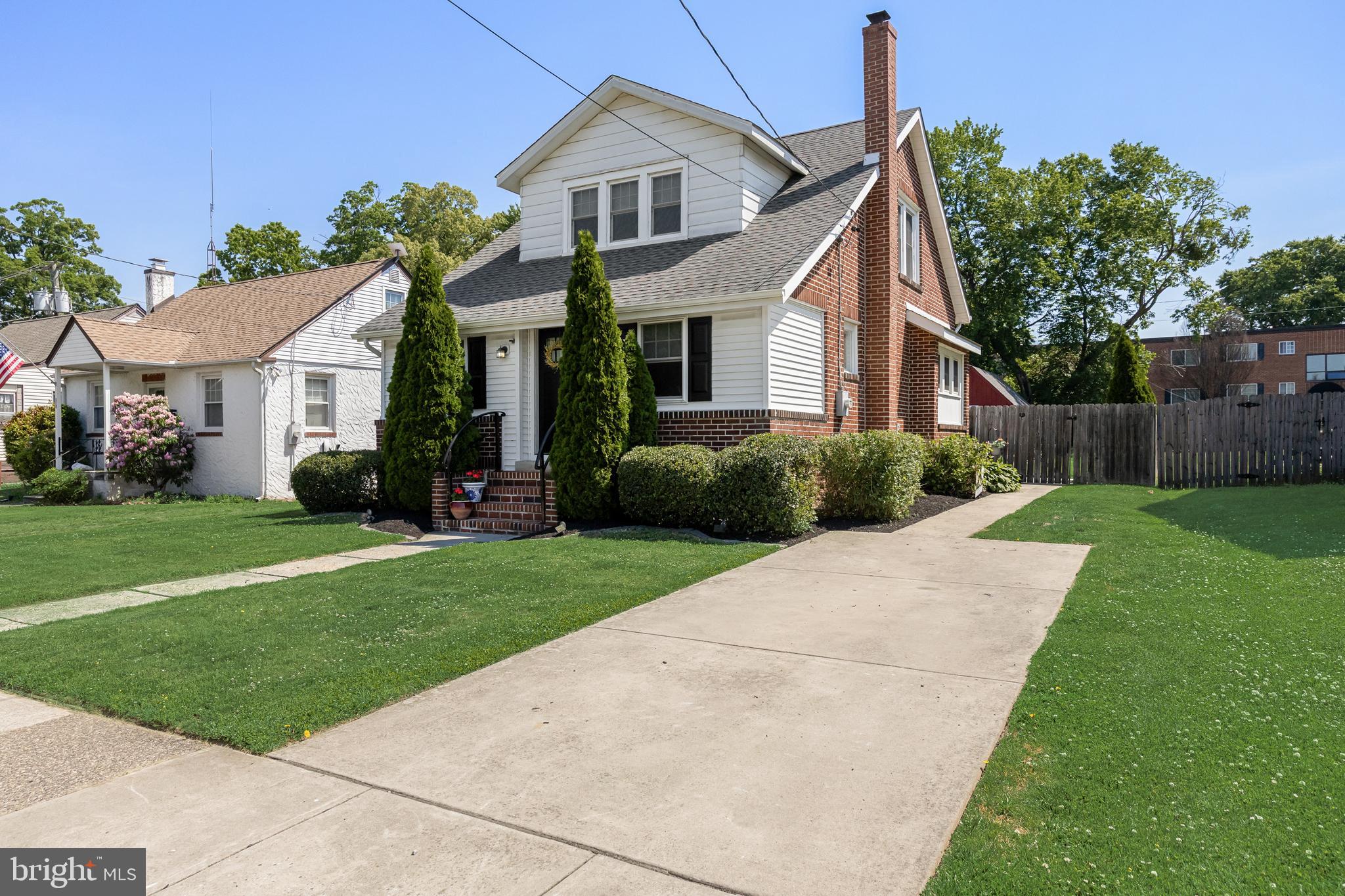 615 North Walnut Avenue Magnolia, NJ 08049 - Photo 3 of 40 a front view of a house with a garden