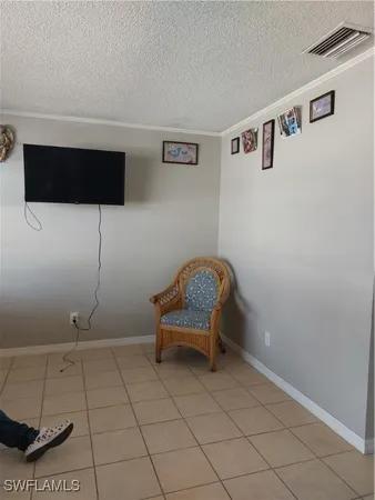a living room with a couch and a flat screen tv