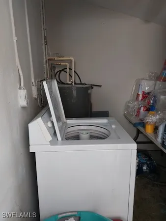 a bathroom with a sink mirror and toilet