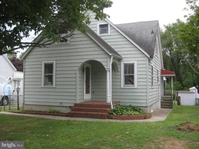 720 Wampler Road Middle River, MD 21220 - Photo 1 of 23 a front view of a house with a garden