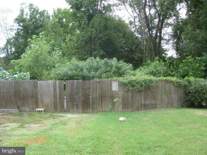 720 Wampler Road Middle River, MD 21220 - Photo 4 of 23 a backyard of a house with lots of green space and lake view