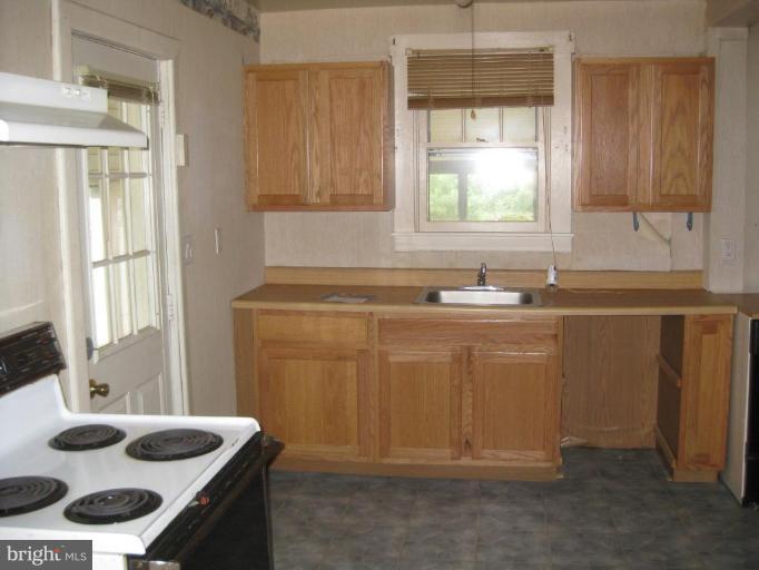 720 Wampler Road Middle River, MD 21220 - Photo 7 of 23 a bathroom with a sink and a mirror