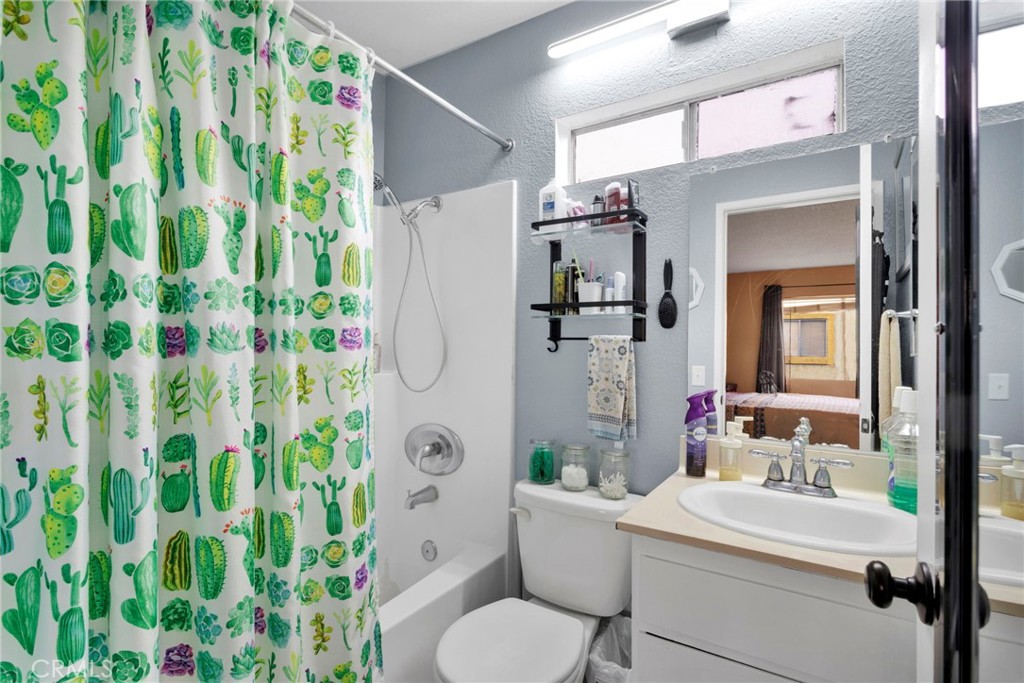 8423 Western Trail Place, Unit H Rancho Cucamonga, CA 91730 - Photo 25 of 42 a bathroom with a sink toilet and shower