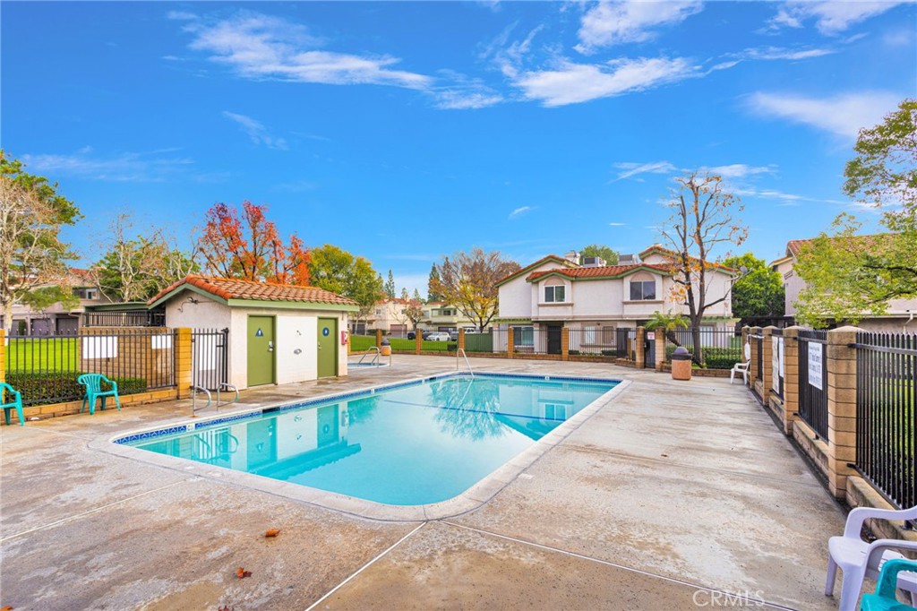 8423 Western Trail Place, Unit H Rancho Cucamonga, CA 91730 - Photo 31 of 42 a view of a house with swimming pool
