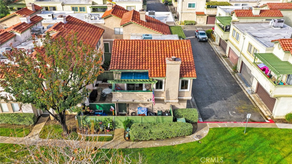 8423 Western Trail Place, Unit H Rancho Cucamonga, CA 91730 - Photo 33 of 42 aerial view of a house with a yard