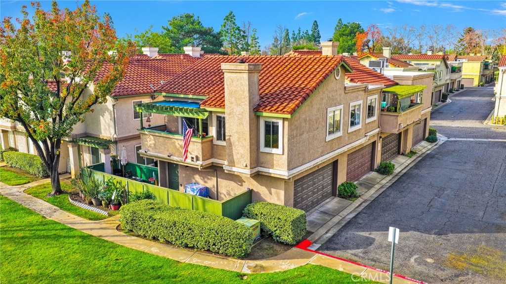 8423 Western Trail Place, Unit H Rancho Cucamonga, CA 91730 - Photo 35 of 42 a aerial view of a house with a yard and potted plants