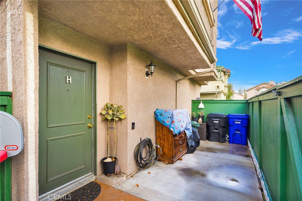 8423 Western Trail Place, Unit H Rancho Cucamonga, CA 91730 - Photo 6 of 42 a view of a porch with wooden floor and stairs