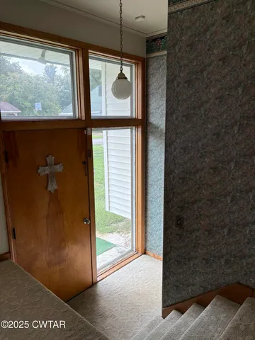 a view of a hallway with a door