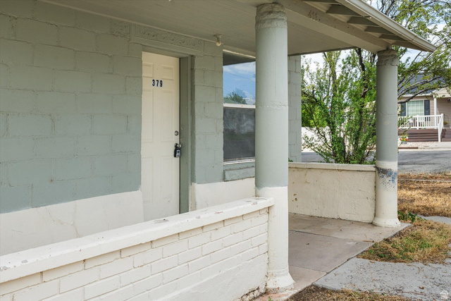 370 West 800 South Beaver, UT 84713 - Photo 2 of 15 Covered front porch featuring two decorative columns and a concrete walkway