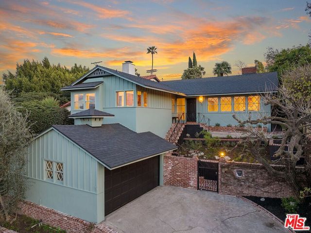 a backyard of a house with yard and outdoor seating