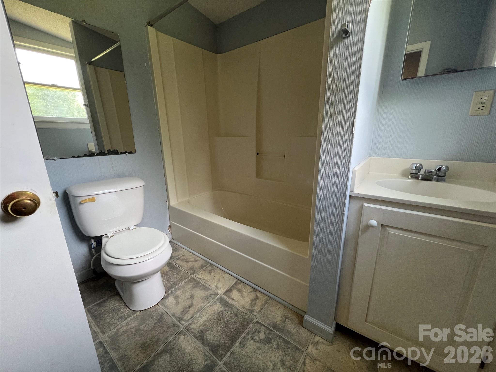 4405 Maple Creek Road Rutherfordton, NC 28139 - Photo 16 of 32 a bathroom with a toilet sink and shower