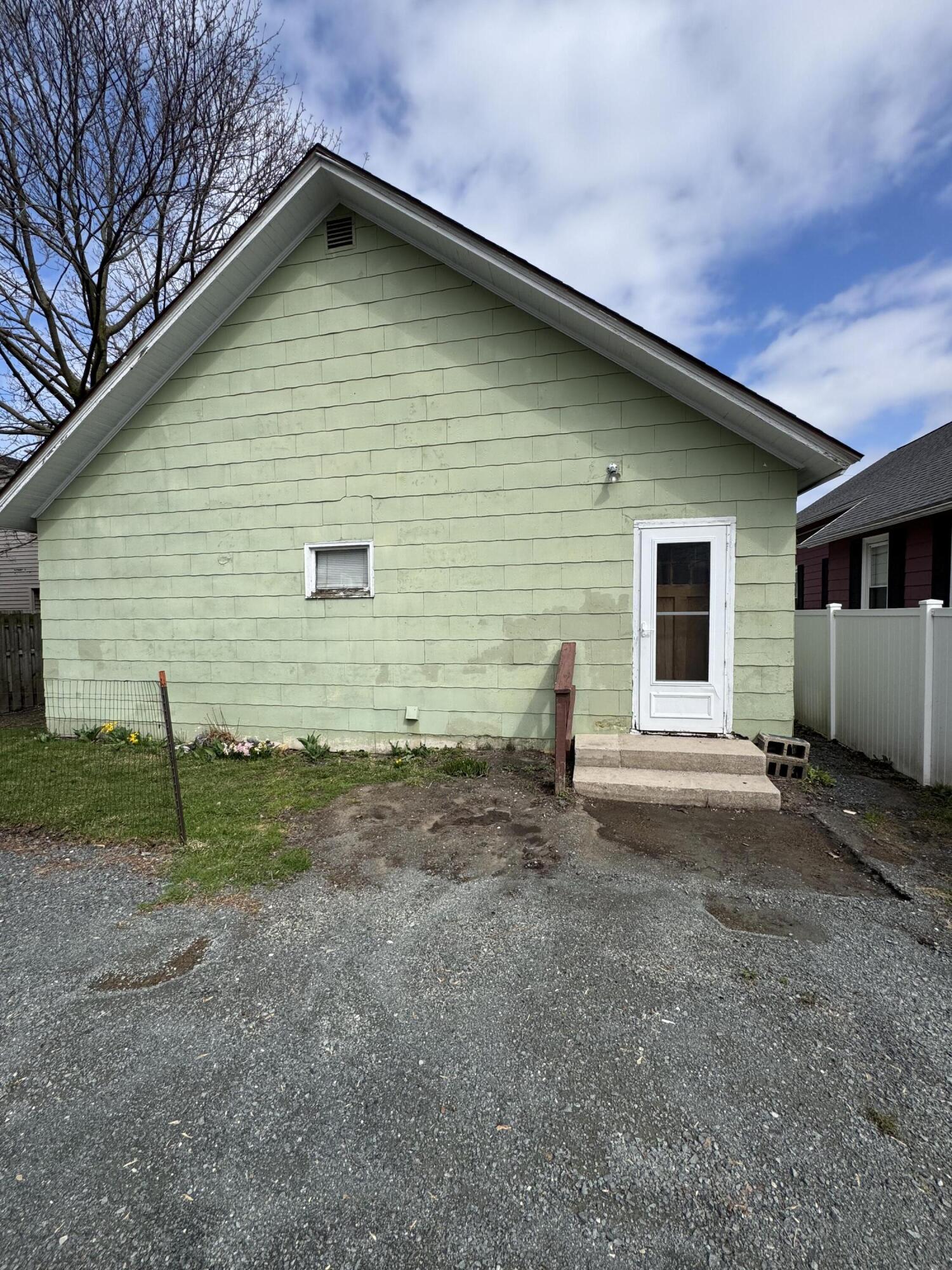 75 Filer Street Manistee, MI 49660 - Photo 4 of 11 Rear of 75 1/2 Filer