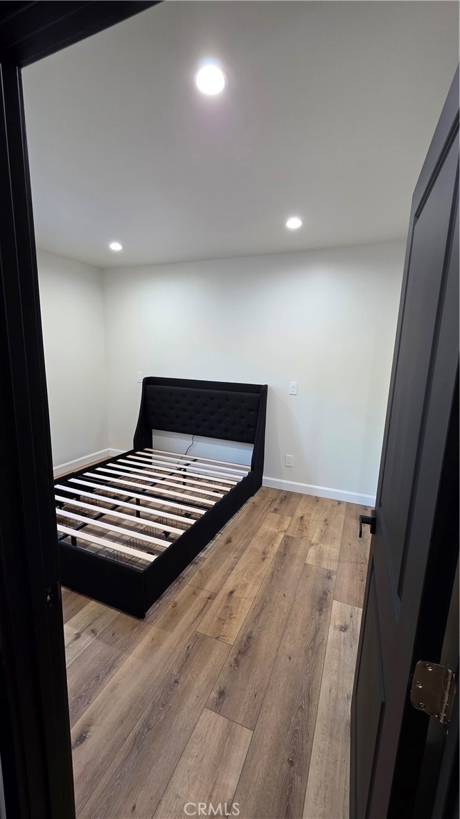 7047 1/2 Nestle Avenue Reseda, CA 91335 - Photo 6 of 7 a view of a room with wooden floor