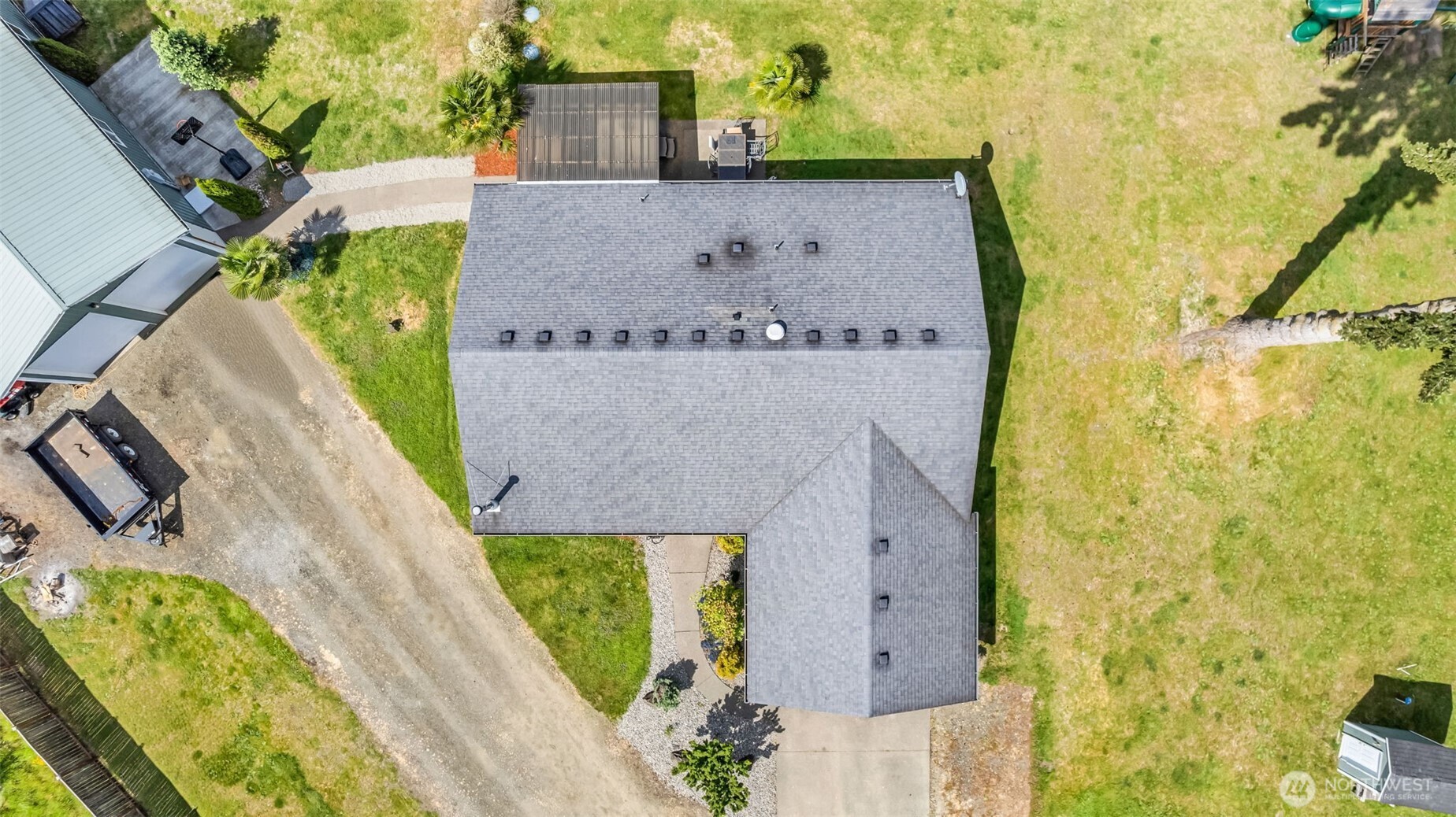 10313 School Land Road Southwest Rochester, WA 98579 - Photo 11 of 40 an aerial view of a house with a yard