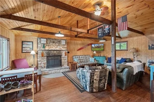 a outdoor space with patio the couches and a fireplace with the potted plants