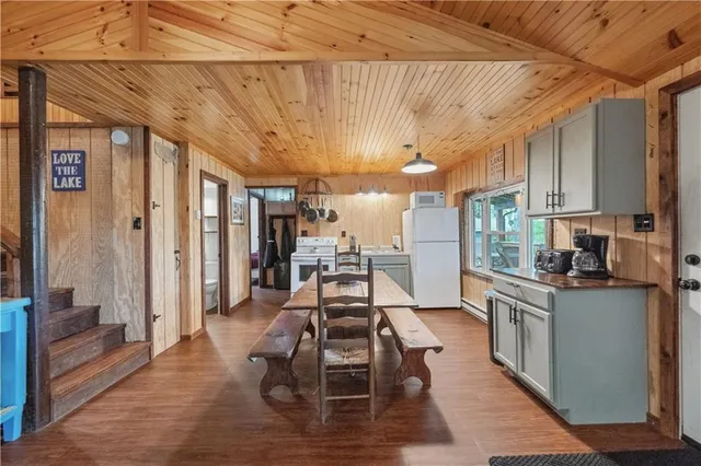 a kitchen with a stove a sink and a refrigerator