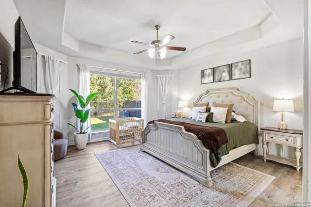 a bedroom with a bed couch and a window