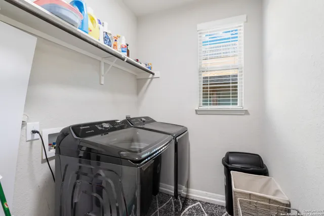 a utility room with dryer and washer
