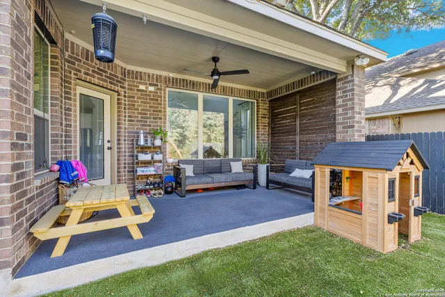 a view of a house with sitting area and garden