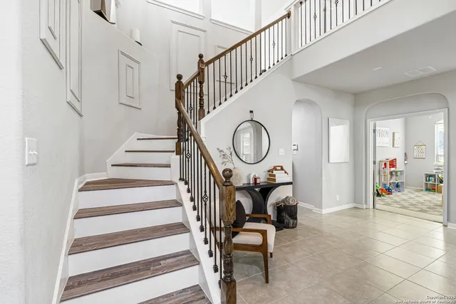 a view of entryway livingroom and hall with wooden floor