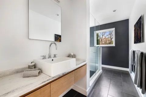 a bathroom with a sink and a mirror