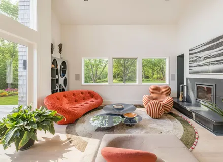 a bedroom with furniture and a fireplace