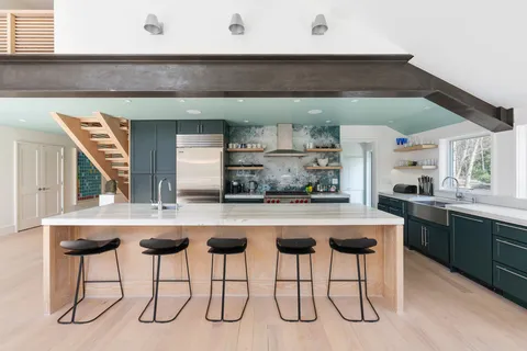 a kitchen with a table and chairs in it