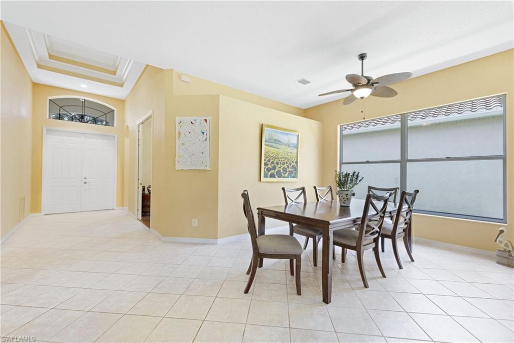 349 Harvard Lane Naples, FL 34104 - Photo 2 of 29 a dining room with furniture and window