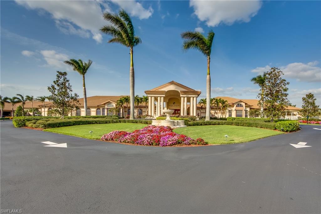 349 Harvard Lane Naples, FL 34104 - Photo 29 of 29 a view of yellow house with a yard and potted plants