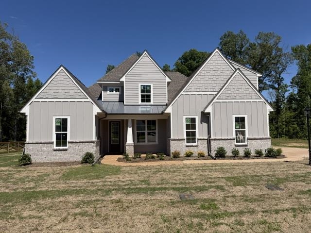 210 Drake Drive Collierville, TN 38017 - Photo 1 of 19 a view of a white house with a yard