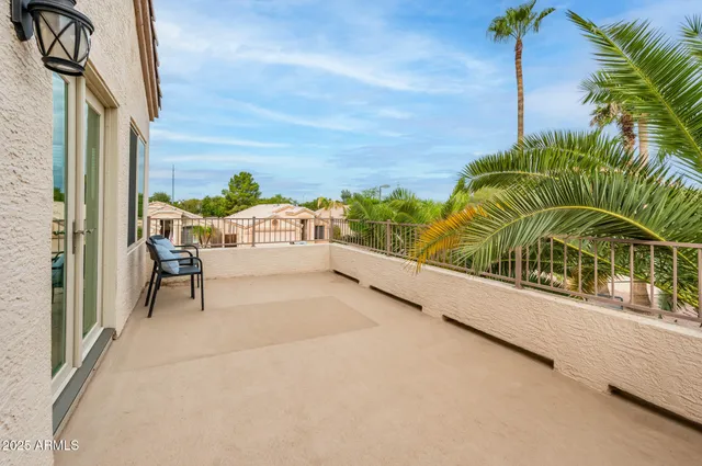 a view of balcony with furniture