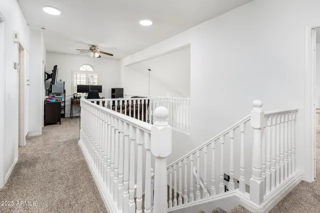 a view of a livingroom with workspace and a window