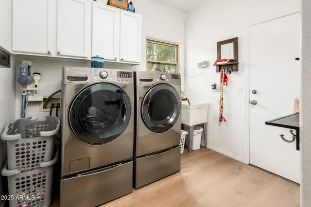a view of a backyard with swimming pool
