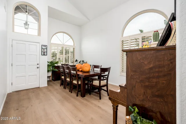 a view of a livingroom with furniture and a window