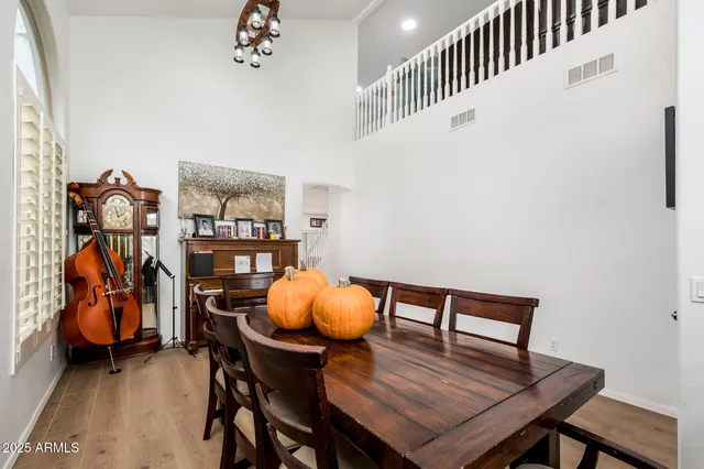 a dining room with furniture and wooden floor