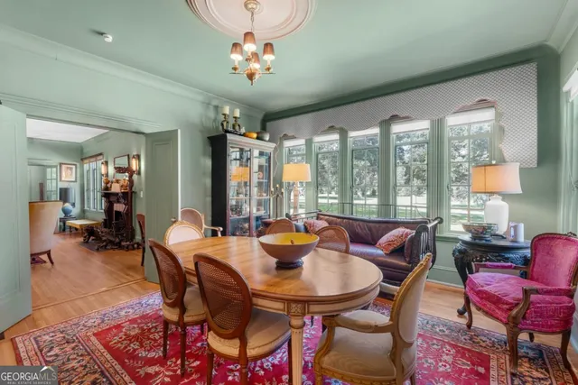 a view of a dining room with furniture window and outside view