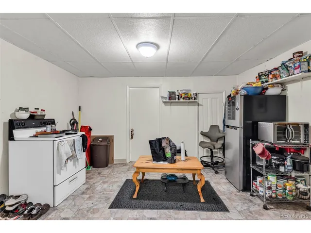 a workspace with furniture and a wooden floor