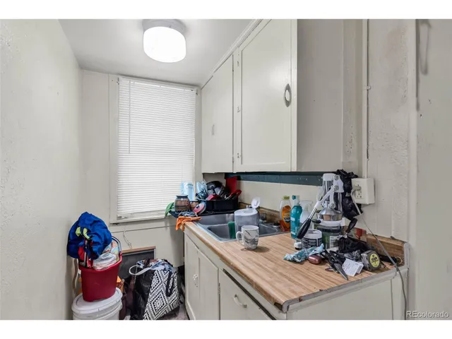 a view of a kitchen with appliances and cabinets