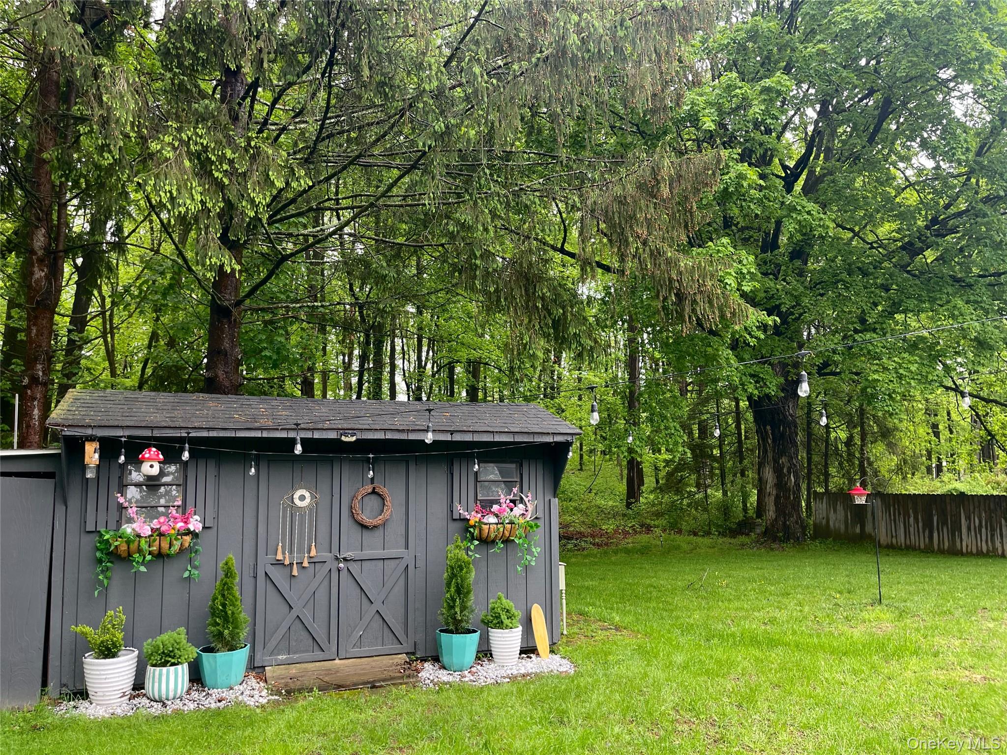 9 King Road Rhinebeck, NY 12572 - Photo 20 of 20 a view of backyard with table and chairs and potted plants
