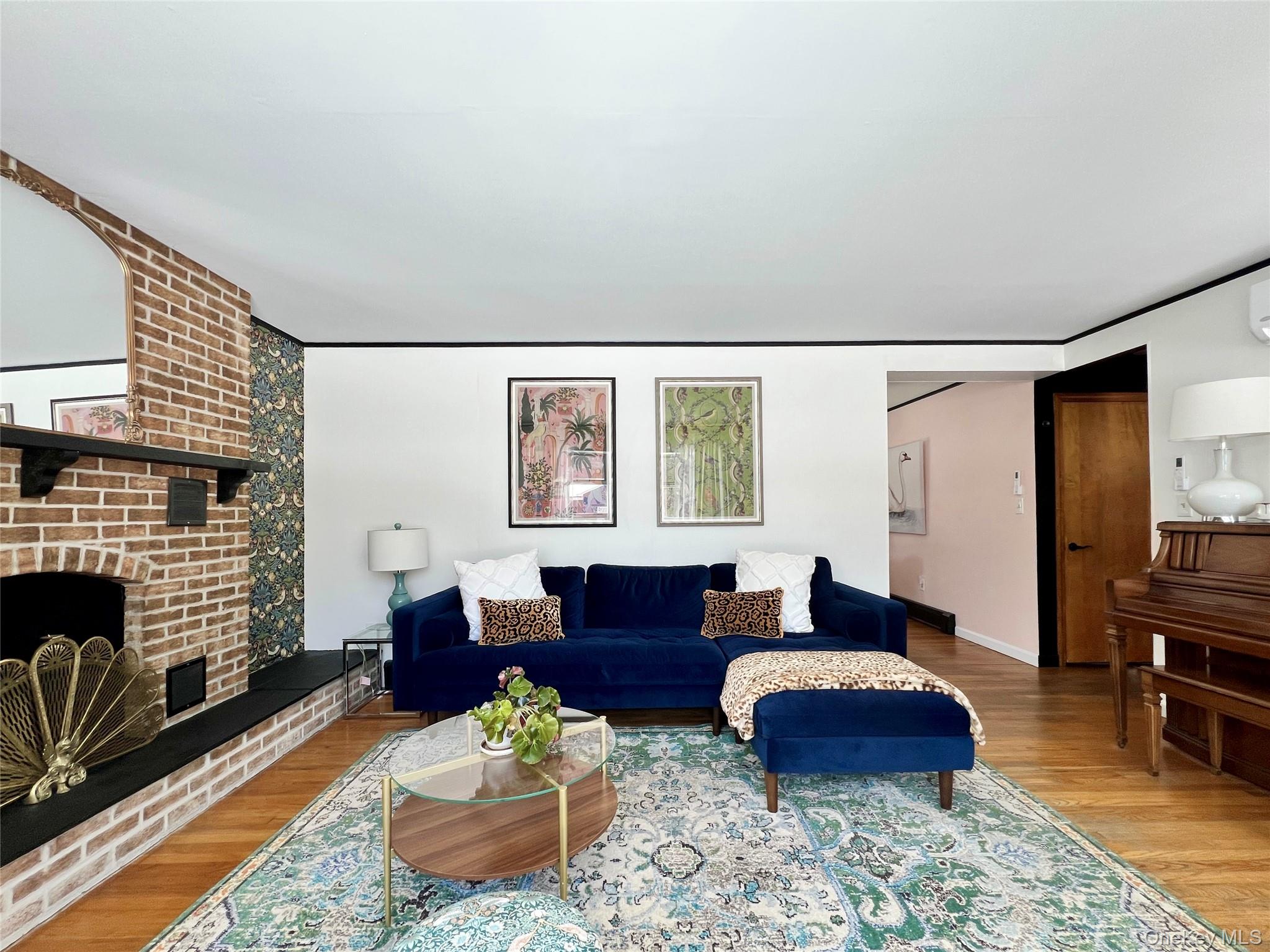 9 King Road Rhinebeck, NY 12572 - Photo 2 of 20 a living room with furniture wooden floor and a fireplace