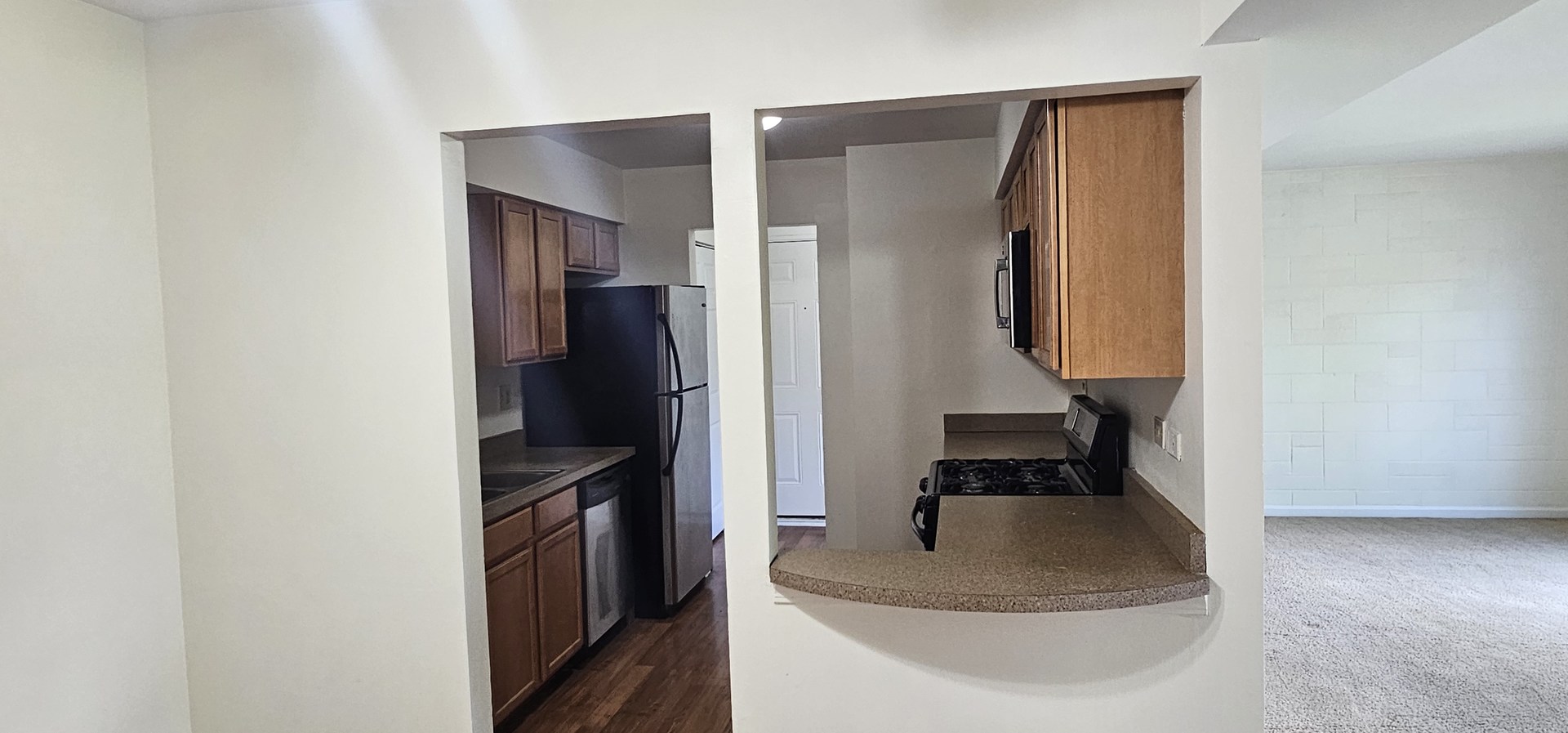 833 Village Quarter Road, Unit A3 West Dundee, IL 60118 - Photo 11 of 27 a kitchen with a refrigerator and a stove